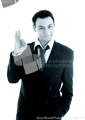 Image of monochrome picture of friendly businessman showing ok sign