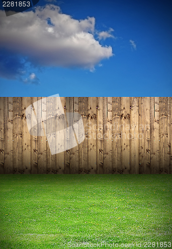 Image of backyard with wooden fence