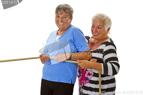 Image of Two female seniors pulling on a rope