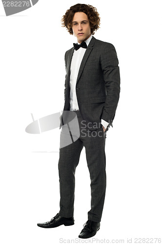 Image of Handsome young groom, full length portrait