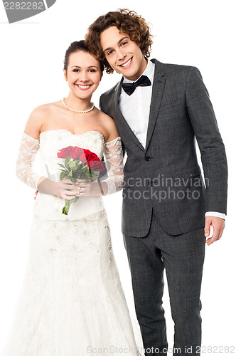 Image of Lovely newlywed couple posing for a portrait