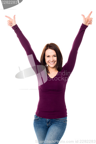 Image of Victorious young woman celebrating her success