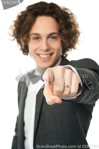 Image of Handsome man in bowtie pointing you out