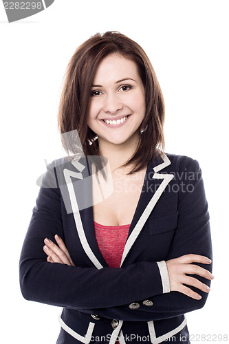 Image of Cheerful young woman posing confidently