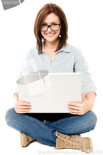 Image of Casual woman working on a laptop