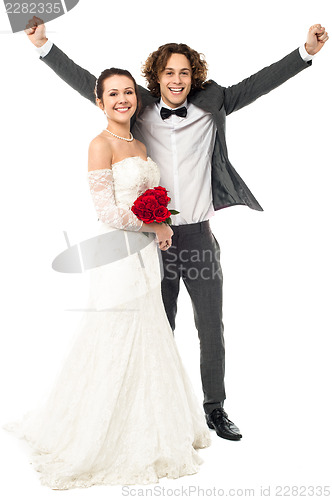 Image of Joyous newlywed couple, excited guy