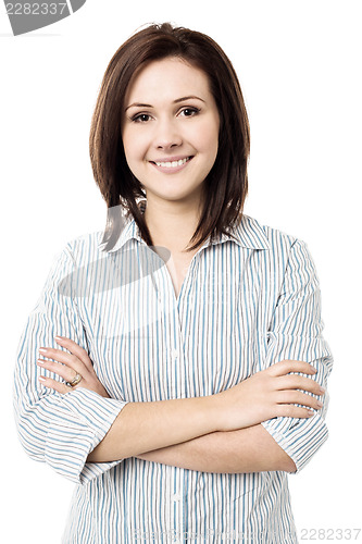 Image of Young smiling female posing confidently