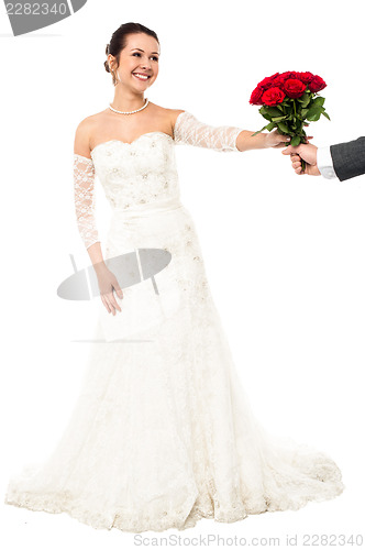 Image of Groom presenting beautiful bride love roses