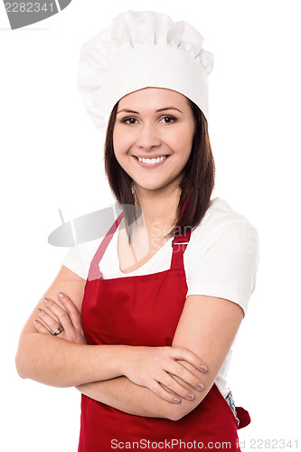 Image of Cheerful confident young female chef