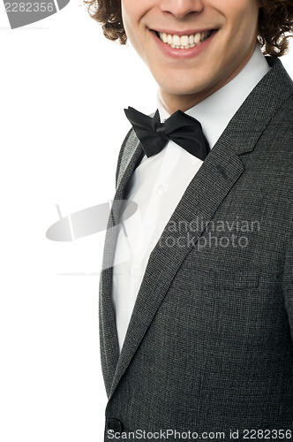 Image of Groom in pose against white background