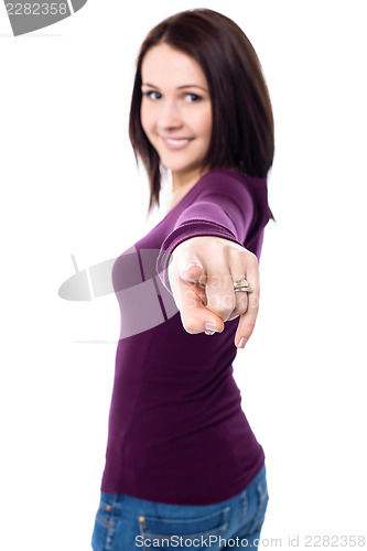 Image of Young girl pointing towards the camera