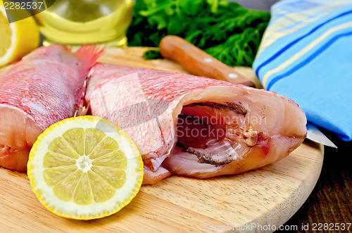 Image of Fillet of sea bass with lemon and knife