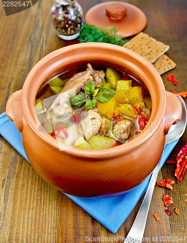 Image of Roast chicken in a clay pot with hot pepper