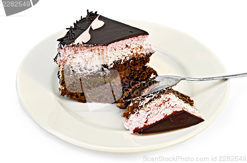 Image of Cake chocolate with pink cream and spoon