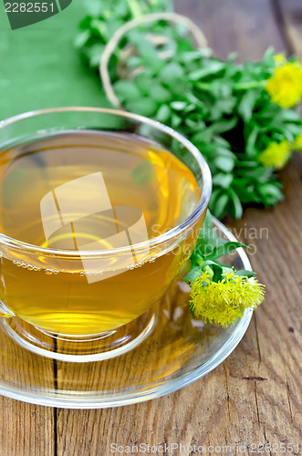 Image of Herbal tea with Rhodiola Rosea on a wooden board