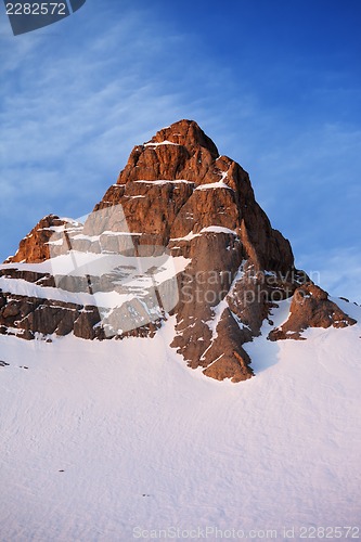 Image of Snowy rocks at sunrise