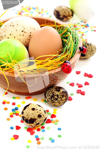 Image of Colorful Easter eggs and cake decorations.