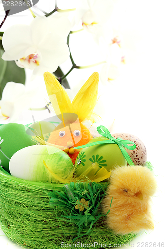Image of Colorful Easter eggs and orange rabbit. 