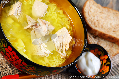 Image of Thick soup with rice and meat closeup.