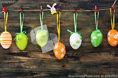 Image of Colorful Easter eggs on a fun clothespins.