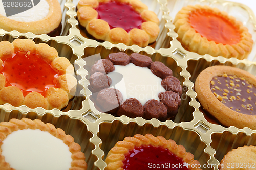 Image of Colorful cookies in a box.