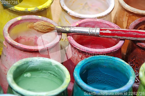 Image of Old brush and colorful bottles