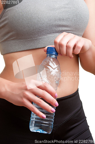 Image of Woman Holding Bottle of Water