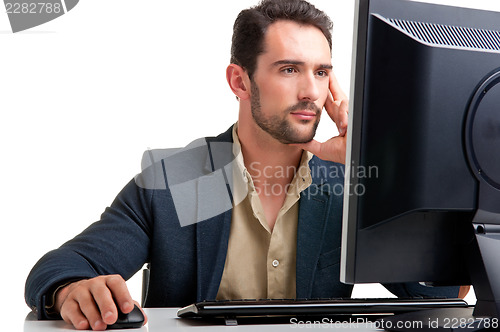 Image of Man Looking At A Computer Monitor