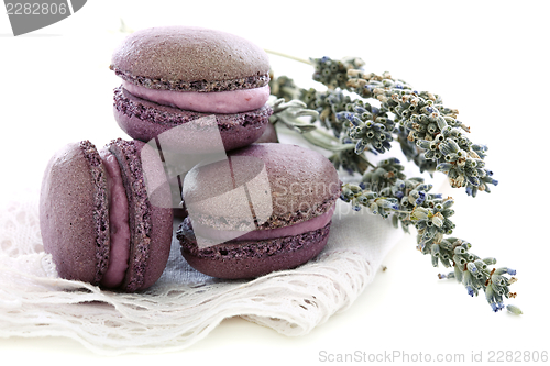 Image of Lavender macaroons on linen napkin. 