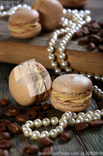 Image of Homemade macaroons and coffee beans.