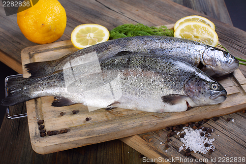 Image of Two trout, pepper and lemon.