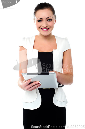 Image of Business executive browsing on tablet device