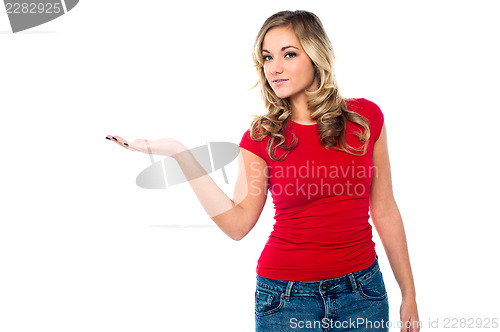 Image of Casual girl presenting something