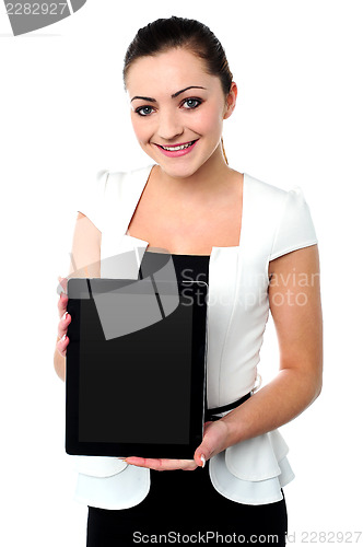 Image of Pretty young girl showcasing a tablet device