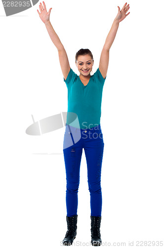 Image of Jubilant young woman in trendy attire