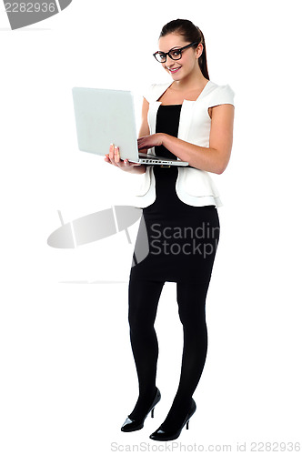 Image of Female secretary using laptop