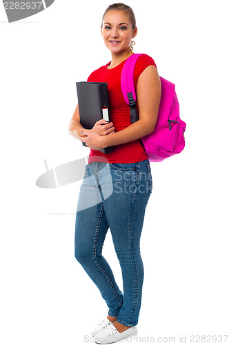 Image of Pretty college student carrying pink backpack