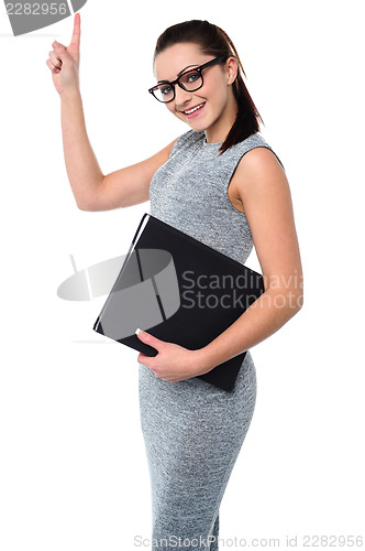 Image of Pretty employee raising her arm up