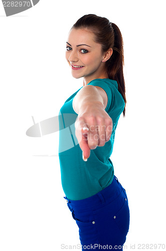 Image of Lovely young pointing towards you