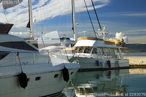 Image of Luxury yachts moored on pier