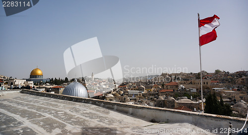 Image of Austrian flag over old city