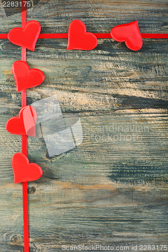 Image of Hearts on a red ribbon.