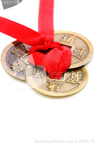 Image of Three Chinese coins close up.