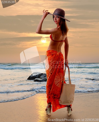 Image of Caucasian woman standing in bikini