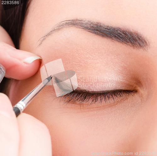 Image of Beautician artist applying makeup