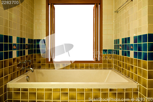 Image of Bathroom with bathtub and open window