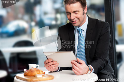 Image of Business executive at open restaurant