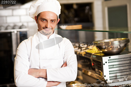 Image of Confident young chef posing