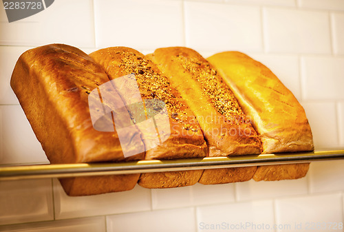 Image of Freshly kneaded grain and white breads for sale