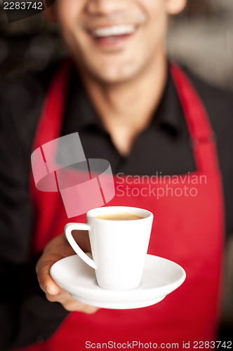 Image of Freshly brewed coffee served with a smile